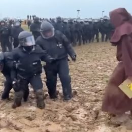 Police Trapped in Mud are Taunted by Costumed “Wizard” at Greta Thunberg’s Protest