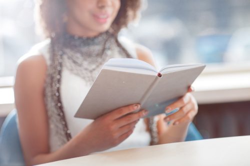 Woman reading book.