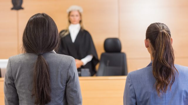 Lawyers listening to the judge in the court room