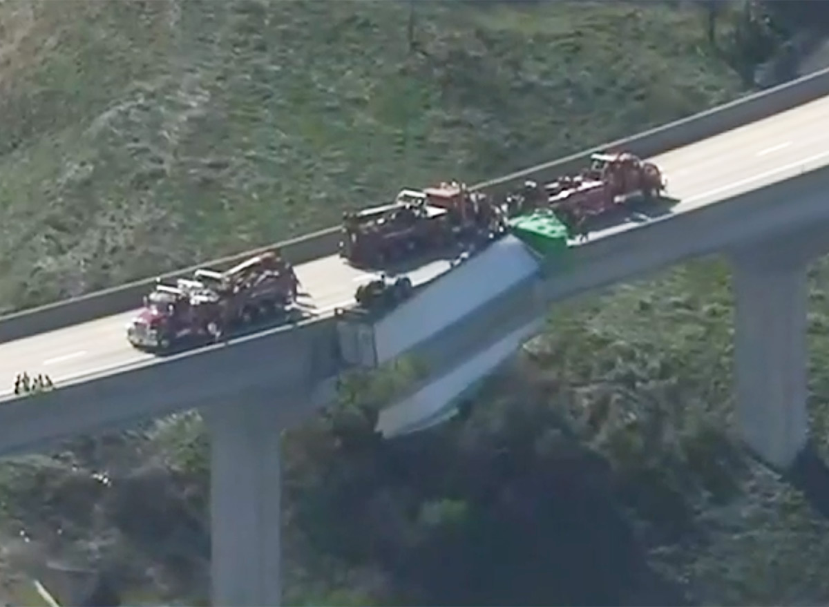 Trucker Cheats Death as Trailer Dangles Off Interstate Bridge