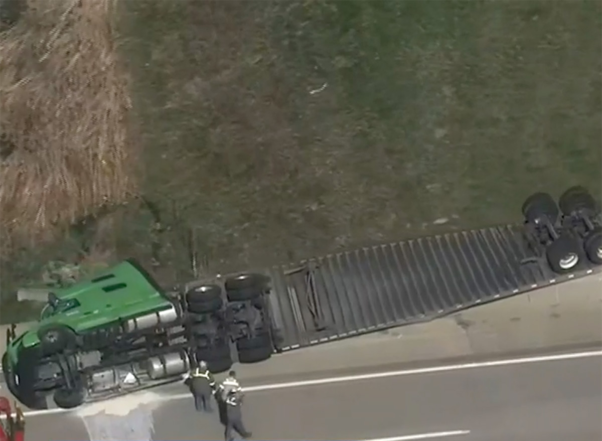 Trucker Cheats Death as Trailer Dangles Off Interstate Bridge