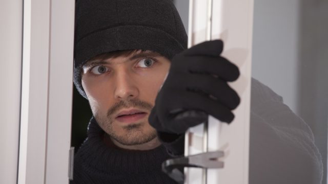 Burglar,With,Crowbar,Breaking,Into,A,House,Through,Glass,Door