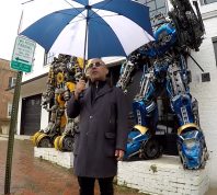 Man Defends Transformers Statues at Home