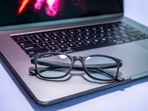 Blue light blocking glasses on the laptop