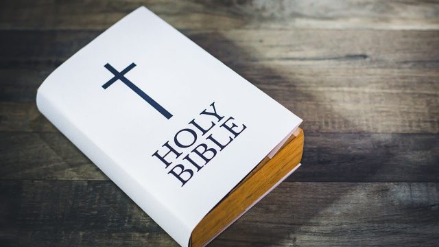 White,Holy,Bible,Book,On,Wooden,Table.