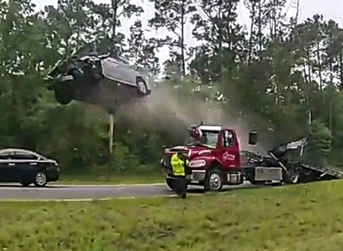 Woman Drives Car Up Tow Truck Ramp, Launches Into The Air