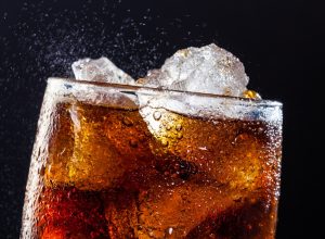 A cool glass of cola drink with ice, bubbles and fizz