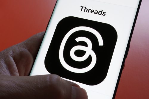 Threads app logo seen on screen.