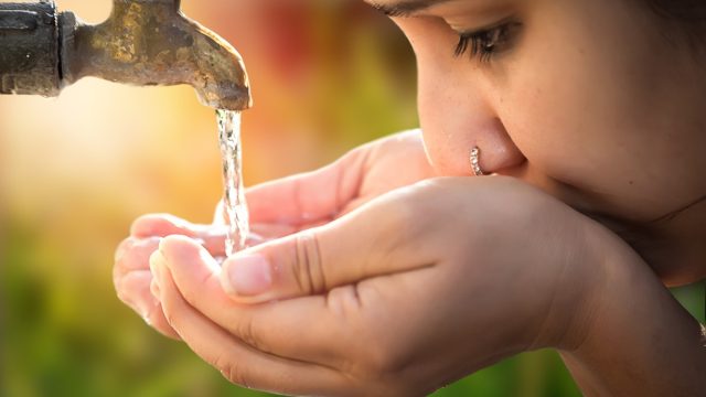 Women,Drinking,Tap,Water,In,Outdoor.