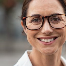 Portrait of mature businesswoman wearing eyeglasses and looking at camera.