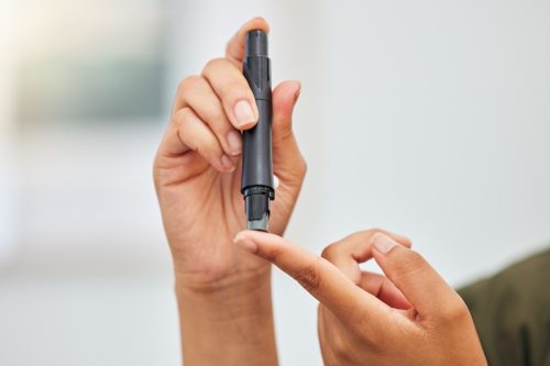 Woman, hands and blood sugar test of diabetes