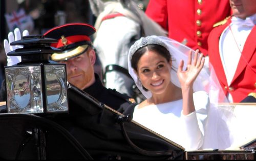 Meghan Markle and Prince Harry wedding, Windsor, Uk - 19.5.2018: Prince Harry and Meghan Markle wedding carriage drives through streets of Windsor then back to Windsor Castle Meghan waving to crowd