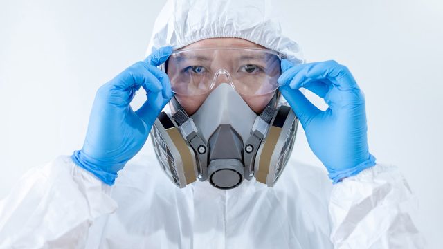 Scientist,Or,Virologist,Man,Wearing,Biohazard,Chemical,Protective,Suit,,Goggles