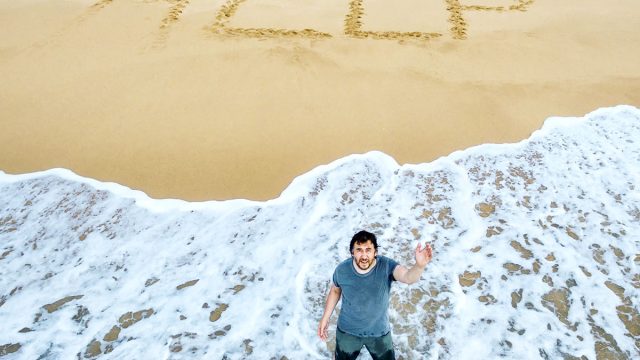 Lost,Man,Calls,For,Help,On,Deserted,Beach,Of,Uninhabited