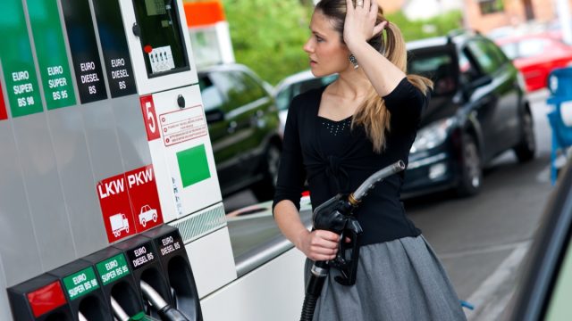 Upset woman in gas station.