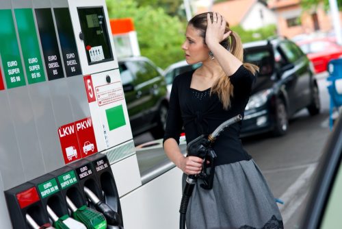 Upset woman in gas station.