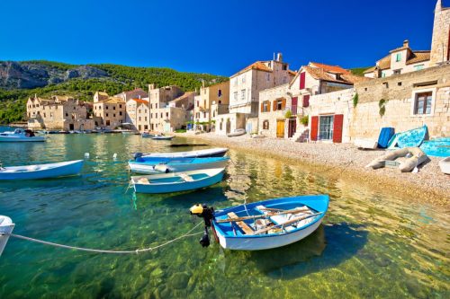 Scenic beach in Komiza village waterfront, Island of Vis, Croatia,