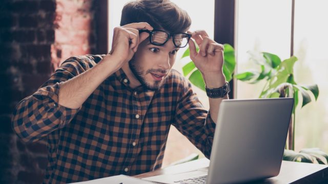 Unbeliveable!,Young,Shocked,Surprised,Man,In,Glasses,Looking,On,Laptop.