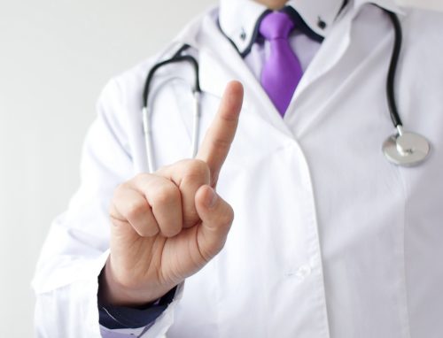 Medical doctor making negative sign for medicine by his finger.