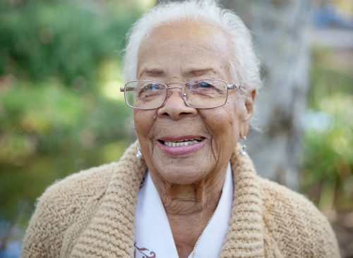 An elderly women smiling