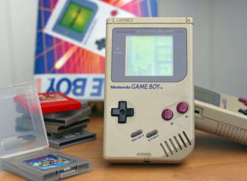 LJUBLJANA, SLOVENIA - DECEMBER 30, 2013: Photo of an original Nintendo handheld video game device Game boy (1989) with Tetris game playing.Showing obvious signs of longtime use.