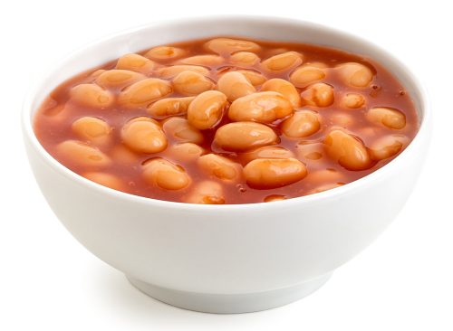 Baked beans in tomato sauce in a white ceramic bowl isolated on white.