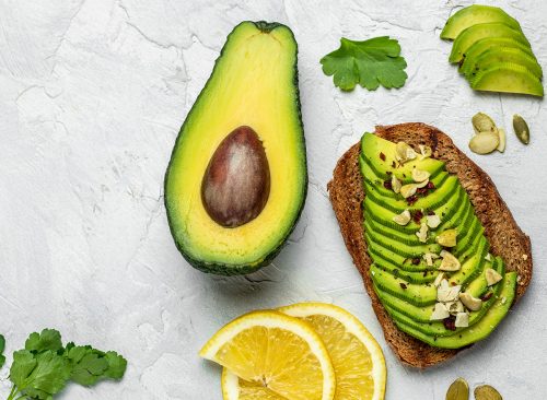 Avocado toast. Healthy toast with avocado for breakfast or lunch with rye bread. Clean eating, dieting, vegan food concept. top view.