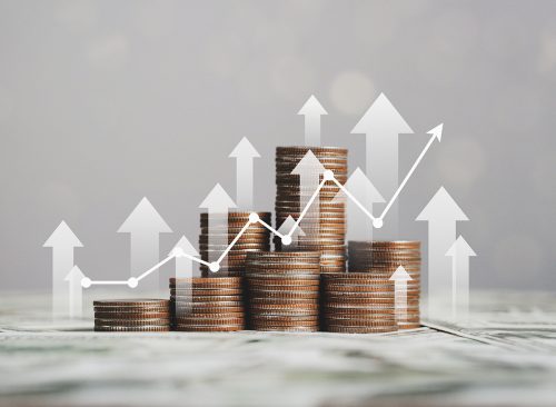 stack of silver coins with trading chart in financial concepts and financial investment business stock growth