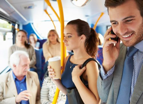 Passengers Standing On Busy Commuter Bus