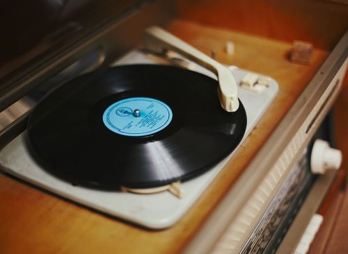 Istra, Russia - September 06, 2021: Vinyl record, spinning on a turntable, Vintage record player with radio 60's.