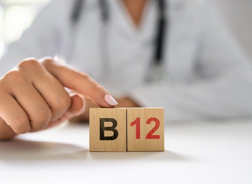 Vitamin B12. Medical Doctor Hand In Hospital