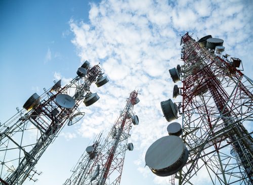 Telecommunication mast TV antennas wireless technology with blue sky in the morning