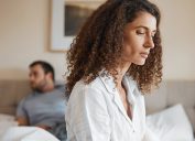 Upset, bedroom and woman in argument with her husband for divorce, marriage problem or breakup. Sad, depression and female person fighting with her partner for toxic relationship or cheating at home.