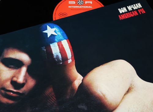 Closeup of singer Don McLean vinyle record cover American Pie (focus on center)