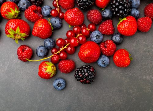 Berries Background. Strawberries, Blueberry, Raspberries, and Blackberry.